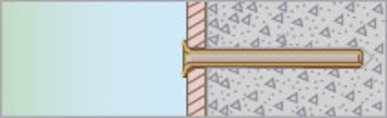 Tvärsnitt av en vägg med isolering och något som liknar en träregel i mitten.