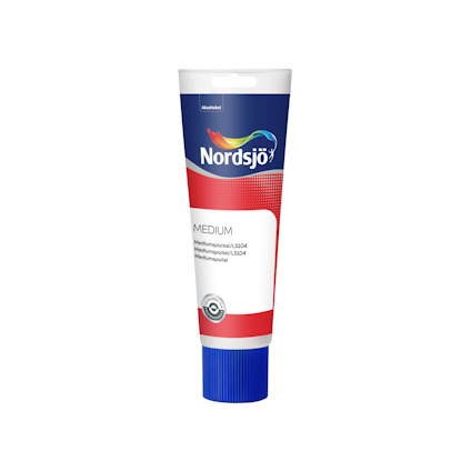Tub av spackel från Nordsjö med en blå kork och texten "Medium" på framsidan.