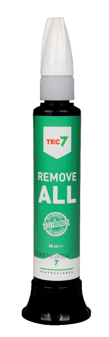 Grön och vit flaska med texten "TEC7 REMOVE ALL" och en vit kork.