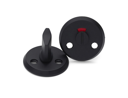 Svarta WC-beslag med en vridknapp och indikator, monterade på runda plattor med skruvhål.