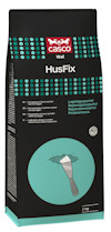 Förpackning av spackelprodukten Casco Wall HusFix med text på flera språk och en illustration av en spackelspatel.
