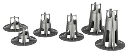 Svarta plastdistansklossar med rund bas och konisk form, arrangerade i två rader på vit bakgrund.