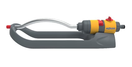Spridare med grå och gul plastkropp, metallisk rördel och ett munstycke med röd detalj.
