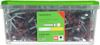 Transparent låda med etikett som visar "Farmarskruv" och detaljerad produktinformation. Lock och skruvar i rött.
